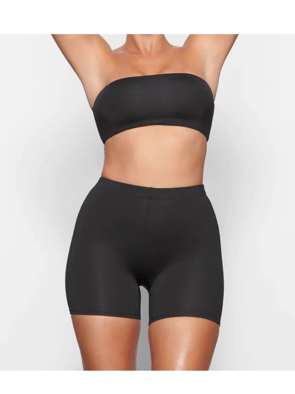 Skims swim shorts and bikini top